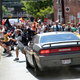 A vehicle drives into a group of protesters demonstrating against a white nationalist rally in Charlottesville, Va. on Aug. 12, 2017, resulting in dozens of injuries and the death of 32-year-old Heather Heyer.